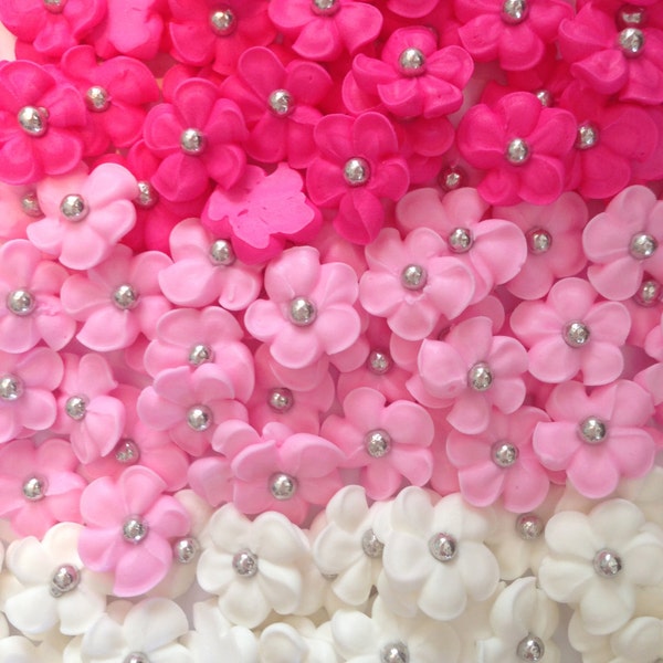 150 royal icing flowers ( 50 white, 50 pink, 50 hot pink) Approx.size 1/2” with silver sugar center