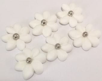 100  white royal icing daises Approx. size 3/4” with silver center