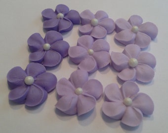 100 royal icing flowers (three shades of purple) Approx. size 3/4” with pearl sugar center