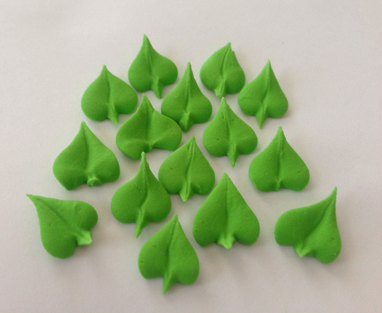 200 green royal icing  leaves Approx. size 3/4”
