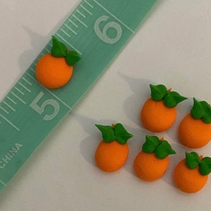 100 royal icing oranges