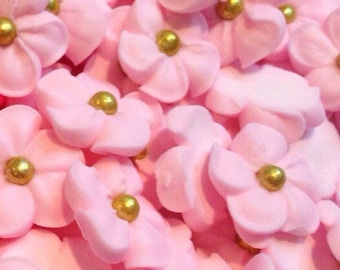 100 pink royal icing flowers Approx.size 1/2” with gold sugar center