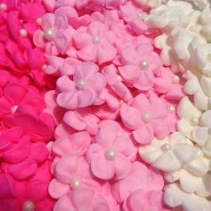 150 royal icing flowers (50 white, 50 pink, 50 hot pink) Approx. size 1/2” with sugar pearl center