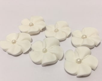 100 white royal icing flowers Approx. size 3/4” with pearl sugar center