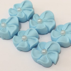 100 royal icing flowers ( light blue) Approx. size 1/2” with sugar pearl center