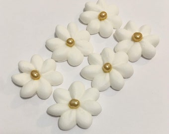 150 royal icing mini daises Approx. size 3/4” with gold sugar center