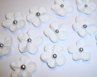 100 white royal icing flowers Approx. size 3/4” with sugar silver center