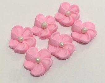 100 pink royal icing flowers Approx. size 1/2” with sugar pearl center