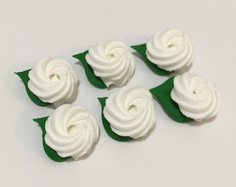 100 white sugar rosettes Approx. size 3/4”