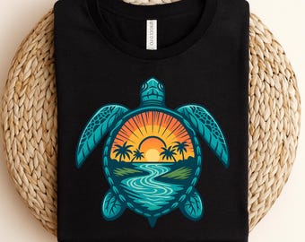 May include: Black t-shirt with a teal turtle design, featuring a sunset scene. The turtle design includes a sunset, palm trees, and a river. The shirt is folded on a woven, beige surface.