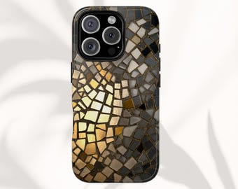 May include: A smartphone case with a mosaic design. The case features a pattern of irregular shapes in shades of gold, brown, gray, and black. The phone's camera lenses are visible at the top.