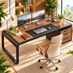 May include: A large executive desk with a walnut wood finish and a black metal frame, featuring a black leather desk mat, two computer monitors, a laptop, a desk lamp, and a matching office chair with a tan seat and white backrest.