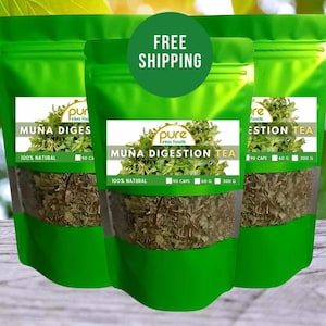 May include: Three green pouches of Muna Digestion Tea, a natural herbal tea. Each pouch contains 90 capsules, 60 grams, and 300 grams of tea. The pouches are labeled with the brand name "Pure Inika Foods" and the product name "Muna Digestion Tea".