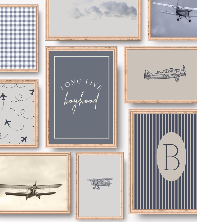 May include: A collection of framed art prints with a vintage aviation theme. Prints include airplane illustrations, cloudscapes, and patterns in shades of blue, gray, and beige. One print features the text "LONG LIVE boyhood".