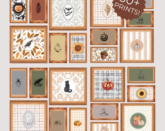 May include: A collection of framed art prints with a fall and Halloween theme. The prints feature pumpkins, bats, ghosts, and other seasonal motifs. The frames are a warm brown color, and the prints have a watercolor style. The text "30+ PRINTS!" is in a brown circle.
