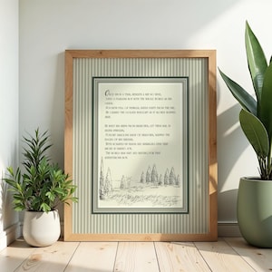 Pode incluir: Uma impressão emoldurada com uma moldura de madeira clara e um fundo listrado verde e branco. A impressão apresenta um poema com uma ilustração em preto e branco de árvores e uma paisagem. O texto diz "Once upon a time..."