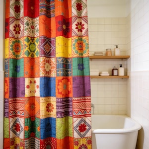 May include: A vibrant patchwork shower curtain with floral and geometric designs. The curtain is composed of squares in red, orange, yellow, green, blue, and purple. It hangs in front of a white bathtub in a tiled bathroom.