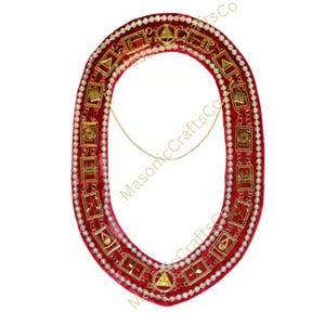 May include: A red velvet collar with gold-colored rectangular and triangular emblems, and a gold chain. The collar is trimmed with small white beads and gold-colored accents. The text "MasonicCraftsCo" is visible.