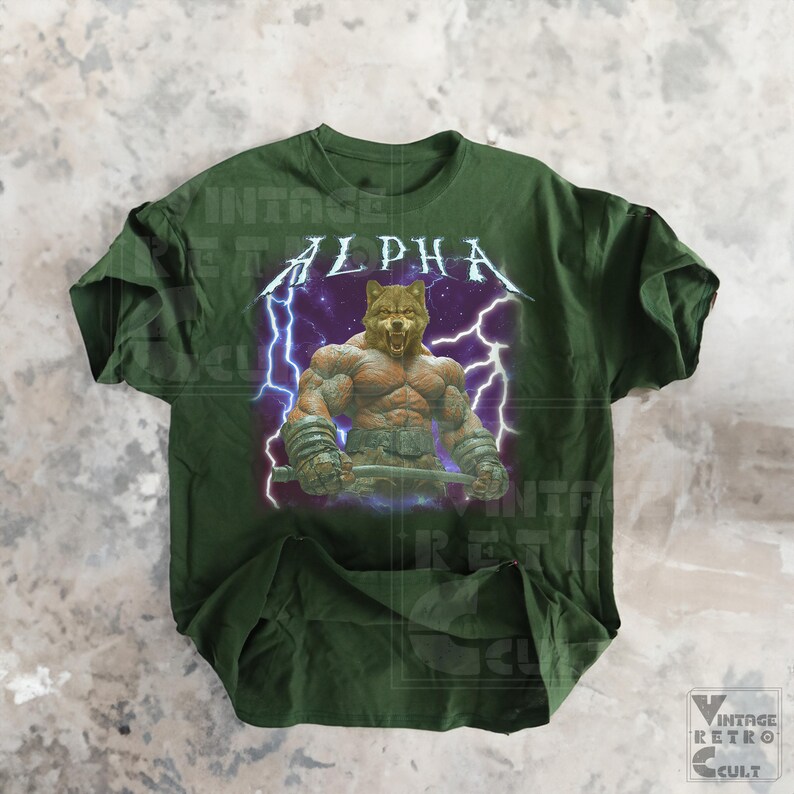 May include: Green t-shirt with a graphic of a muscular wolf with lightning bolts and the word "ALPHA" in a metal font.