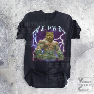 May include: Black t-shirt with a graphic of a wolf with lightning bolts and the word "ALPHA" printed on it.