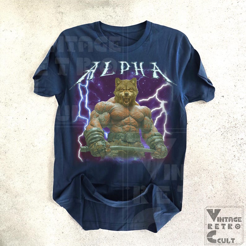 May include: A navy blue t-shirt with a graphic of a wolf with a muscular body, lightning bolts, and the word "ALPHA" in white letters.