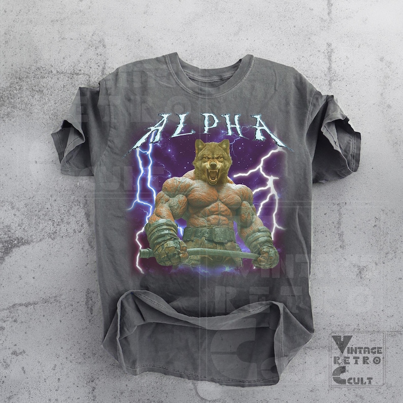 May include: A gray t-shirt with a vintage-style graphic of a muscular wolf with lightning bolts and the word "ALPHA" in a bold font.