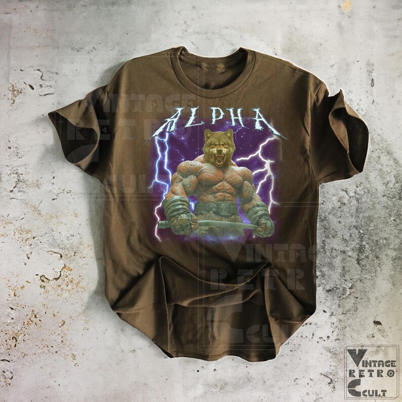 May include: Brown t-shirt with a graphic of a muscular wolf with lightning bolts and the word "ALPHA" printed on it.
