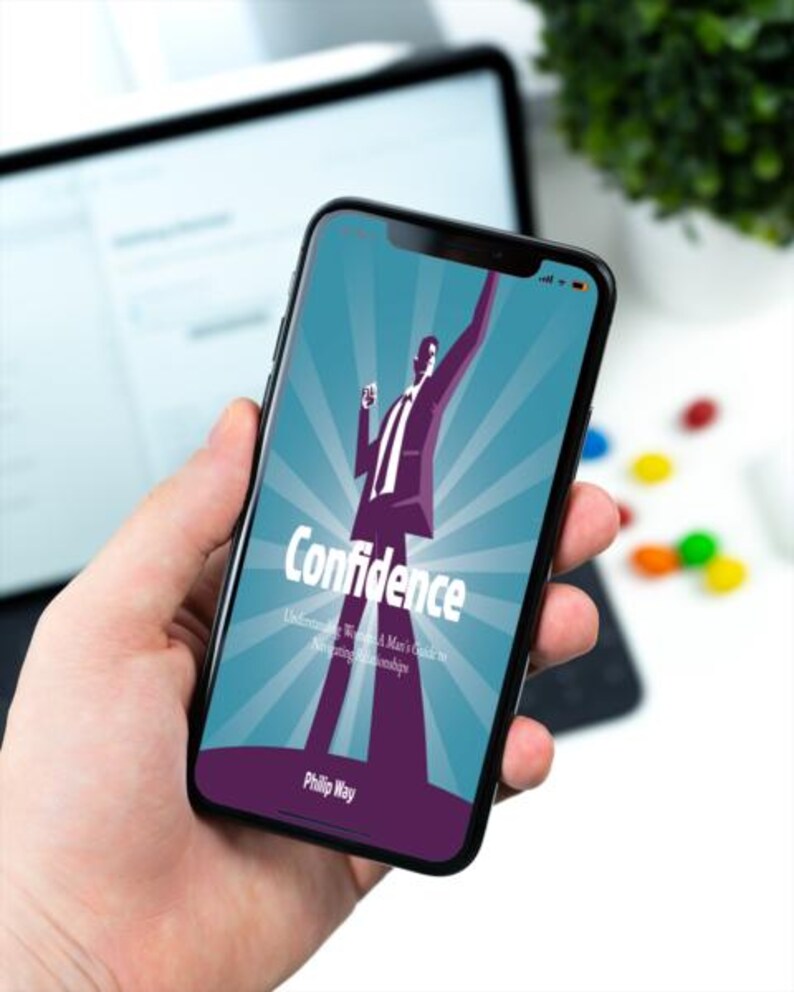以下が含まれることがあります： スマートフォンには、「Confidence」というタイトルの本の表紙が表示されています。スーツを着た男性のグラフィックが描かれています。背景はターコイズブルーで、放射線状の線があります。著者の名前、Philip Wayは一番下にあります。