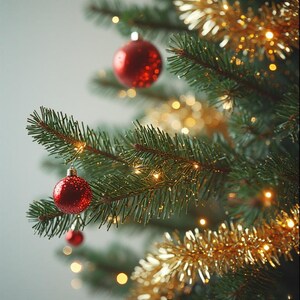 May include: Close-up of a decorated Christmas tree. The tree features red ornaments, gold tinsel, and small, warm white lights. The evergreen branches are a deep green, creating a festive holiday scene.
