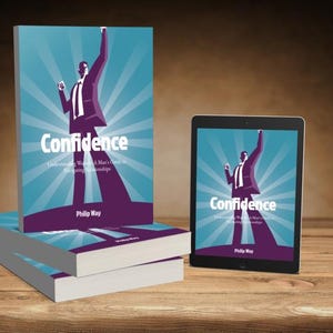 以下が含まれることがあります： 「Confidence」Philip Way著の書籍とタブレット。表紙には、スーツ姿で腕を上げた人物のイラストが描かれています。背景は青色で放射線状の線があります。木製の表面に置かれています。