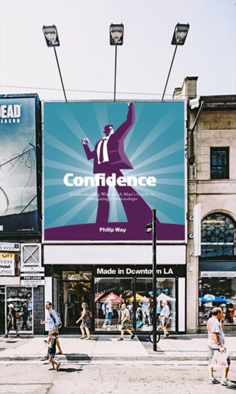 May include: A large billboard displays the word "Confidence" with a stylized illustration of a man in a suit. The billboard is above a storefront with the text "Made in Downtown LA". People are walking on the sidewalk.