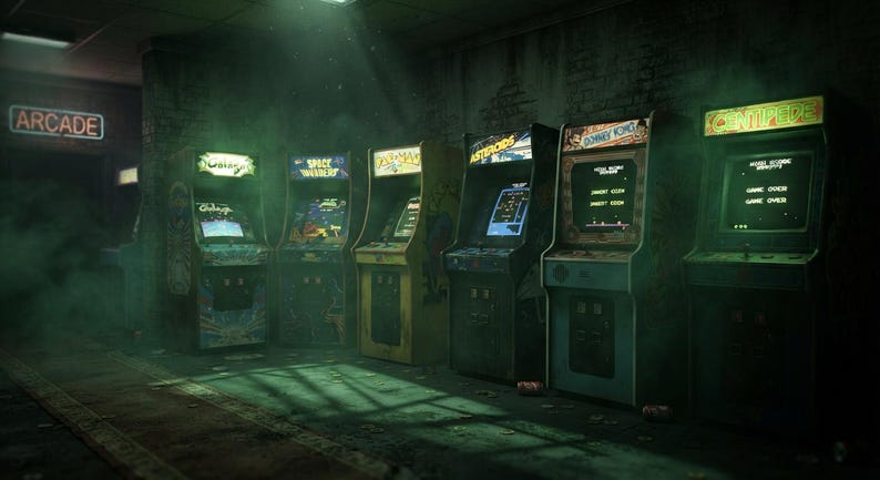 May include: A row of six vintage arcade game cabinets in a dimly lit room with green ambient lighting. The machines feature illuminated screens displaying titles like Galaga, Space Invaders, Pac-Man, Asteroids, Donkey Kong, and Centipede in a dark setting.