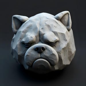 May include: A gray, stone-like sculpture of a bulldog's head. The sculpture has a textured surface with visible cracks and a slightly grumpy expression. The dog's nose is black, and the eyes are partially closed.