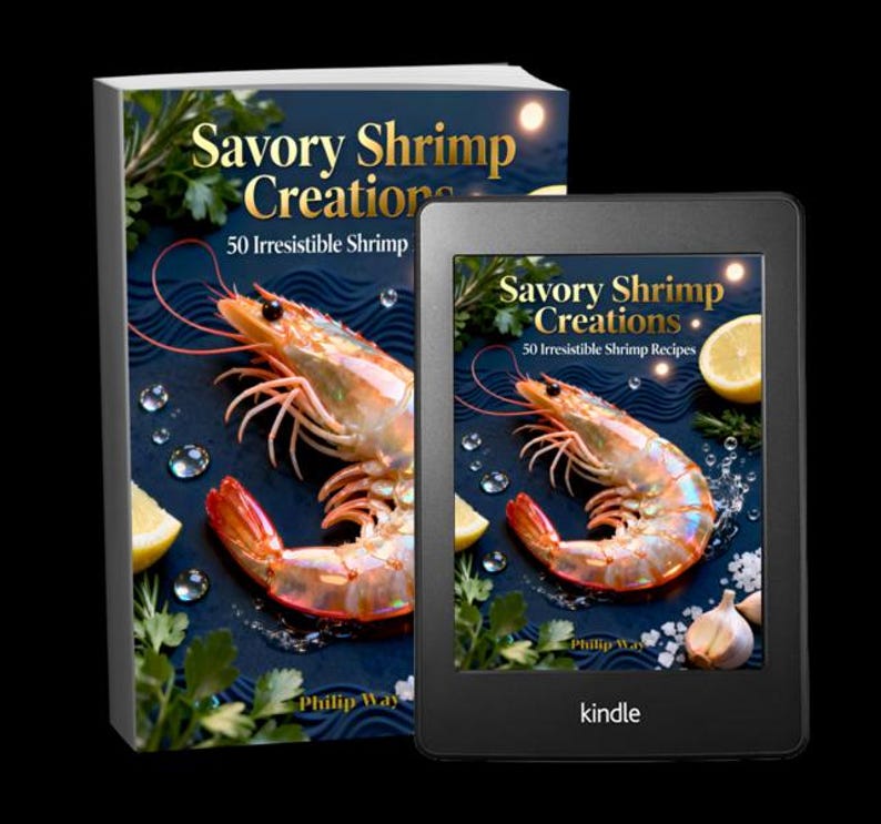 May include: A cookbook titled "Savory Shrimp Creations" with a large image of a cooked shrimp, lemon slices, and herbs. The book is next to a Kindle e-reader displaying the same cover art. The Kindle is black.