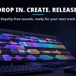 May include: A computer monitor displaying a colorful digital audio workstation interface with waveform tracks. The text reads: DROP IN. CREATE. RELEASE. Royalty-free sounds, ready for your next track. A black keyboard and mouse are in the foreground.