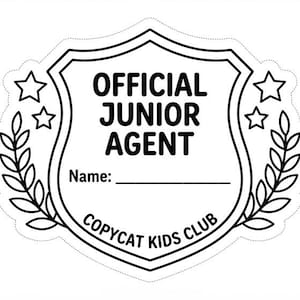 May include: A black and white sticker shaped like a shield featuring the text OFFICIAL JUNIOR AGENT, a line for a name, and the text COPYCAT KIDS CLUB. The design includes two stars on each side and laurel leaf branches flanking the shield.