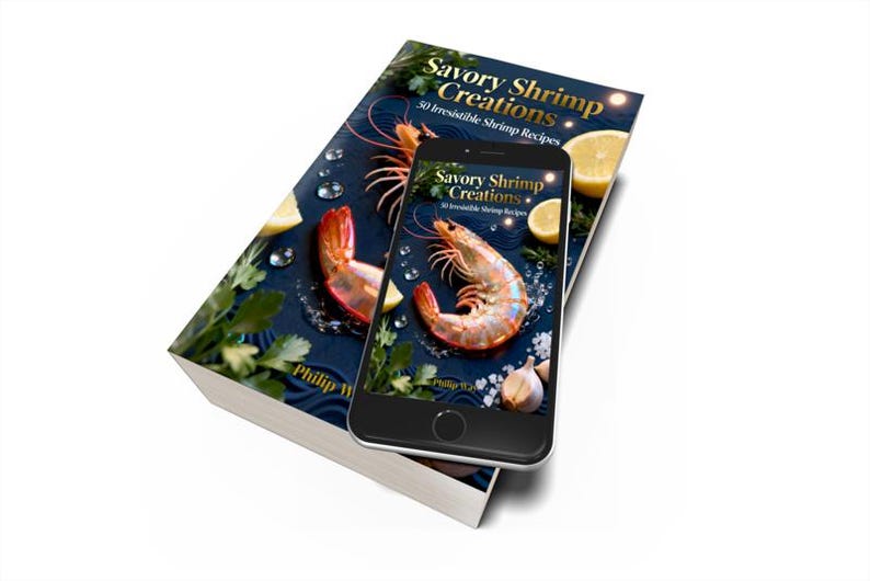 May include: A cookbook titled "Savory Shrimp Creations" with a shrimp and lemon graphic. A smartphone displays the same cover design. The book and phone are on a white surface. The book cover reads "50 Irresistible Shrimp Recipes."