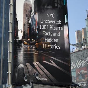 May include: A large billboard in New York City displays the book cover for "NYC Uncovered: 1001 Bizarre Facts and Hidden Histories" by Philip Way. The image shows a city street scene with yellow cabs.