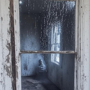 May include: An aged, weathered window frame with peeling white paint. The window reveals a dimly lit interior with a figure seated inside. The glass is streaked, obscuring the view. The overall scene evokes a sense of abandonment and mystery.