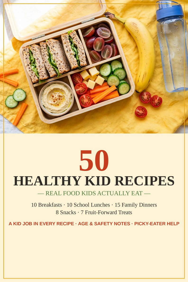May include: A wooden bento box containing sandwiches, grapes, cheese cubes, hummus, and vegetables, next to a banana and water bottle. The text reads 50 HEALTHY KID RECIPES, REAL FOOD KIDS ACTUALLY EAT, 10 Breakfasts, 10 School Lunches, 15 Family Dinners.