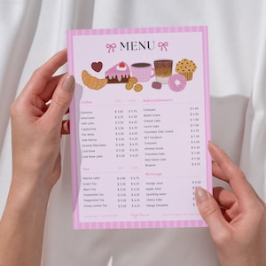 May include: A pink menu with a striped border is held by two hands. The menu features illustrations of coffee, pastries, and desserts. The word "MENU" is at the top, and the menu items are listed below.
