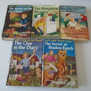 May include: Five vintage Nancy Drew mystery books. Titles include "The Secret of the Old Clock", "The Bungalow Mystery", "The Clue of the Broken Locket", "The Clue in the Diary", and "The Secret at Shadow Ranch". Each book features colorful cover illustrations and the author's name, Carolyn Keene.