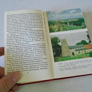 May include: Open book with two images of churches and text. The top image shows a church in a landscape. The bottom image shows a stone church with a tower. The text describes the churches and their locations.