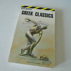 May include: A Cliffs Notes study guide titled Greek Classics with a yellow and black striped top border. The cover features a central illustration of a bronze-toned discus thrower statue in front of a Greek temple, with the Cliffs Notes logo below.
