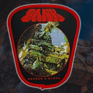 May include: Embroidered patch with a black background and a red border. The patch features the word "MAUS" in red block letters above a circular image of a temple. The text "HONOUR & BLOOD" is below the image.