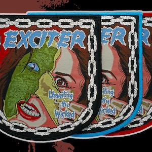 May include: Three embroidered patches with a retro comic book style. Each patch features a woman's face and the word "EXCITER" in blue, with the phrase "Unveiling the Wicked". The patches have black, blue, and red borders with a silver chain design.