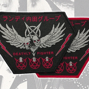 May include: Two black hexagonal embroidered patches featuring a central design of two skulls with wings and a pentagram. The text reads "ランディ内田グループ" and "DEATHLY FIGHTER" with the letters R, U, G inside red pentagrams and red lightning bolts.