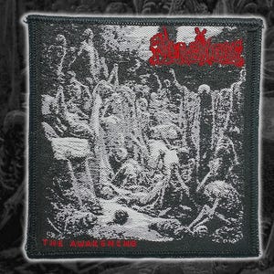 May include: Square black and white patch with a detailed illustration of figures in a dark, gothic scene. The word "Awakening" is printed in red at the bottom, and a red logo is at the top. The patch has a black border.
