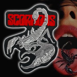 May include: Embroidered patch with a grey scorpion design and the word "SCORPIONS" in red. The patch is on a black background. The image also includes a person's mouth with a scorpion on the tongue.