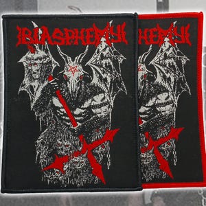 May include: Two black patches with a red and white graphic of a horned figure with wings, a pentagram, and the word "BLASPHEMY" in red. One patch has a red border.